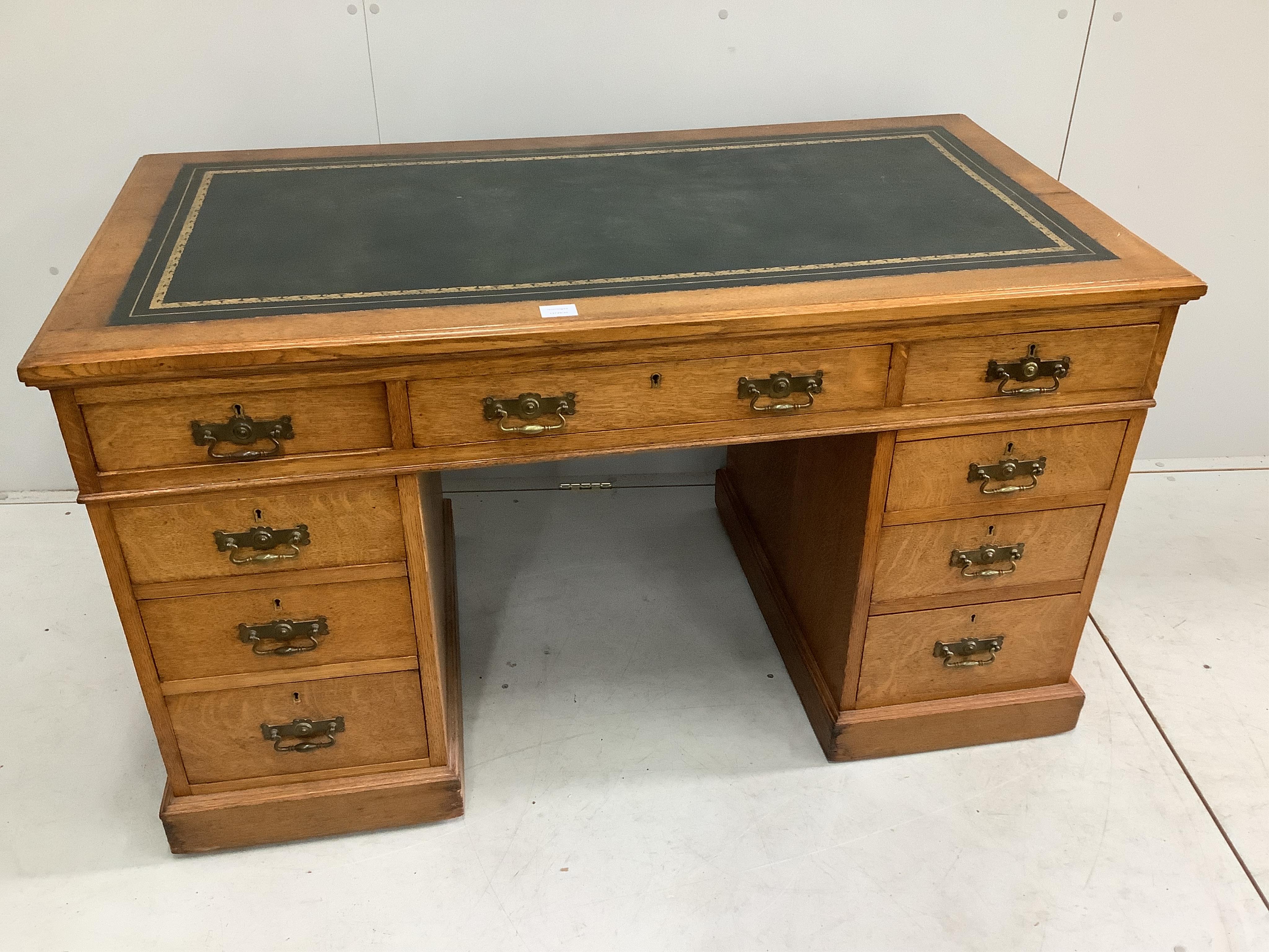 A late Victorian oak pedestal desk, width 132cm, depth 70cm, height 75cm